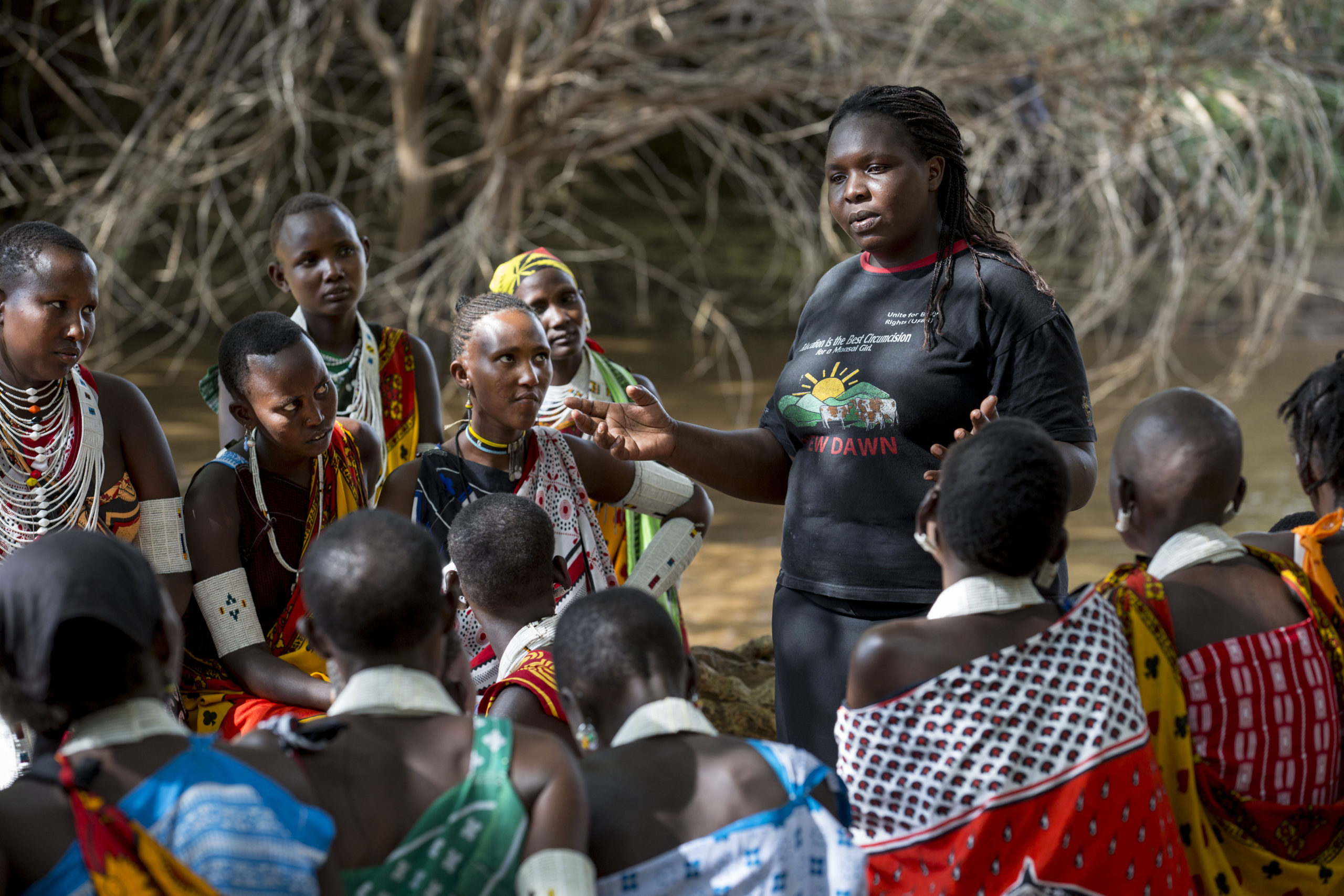 Maasai tribe young mothers gather for a forum organized by AMREF, and geared at family planning and other sexual reproductive health options. During the discussions, the community health worker demonstrates condom usage, and other options for contraceptives.